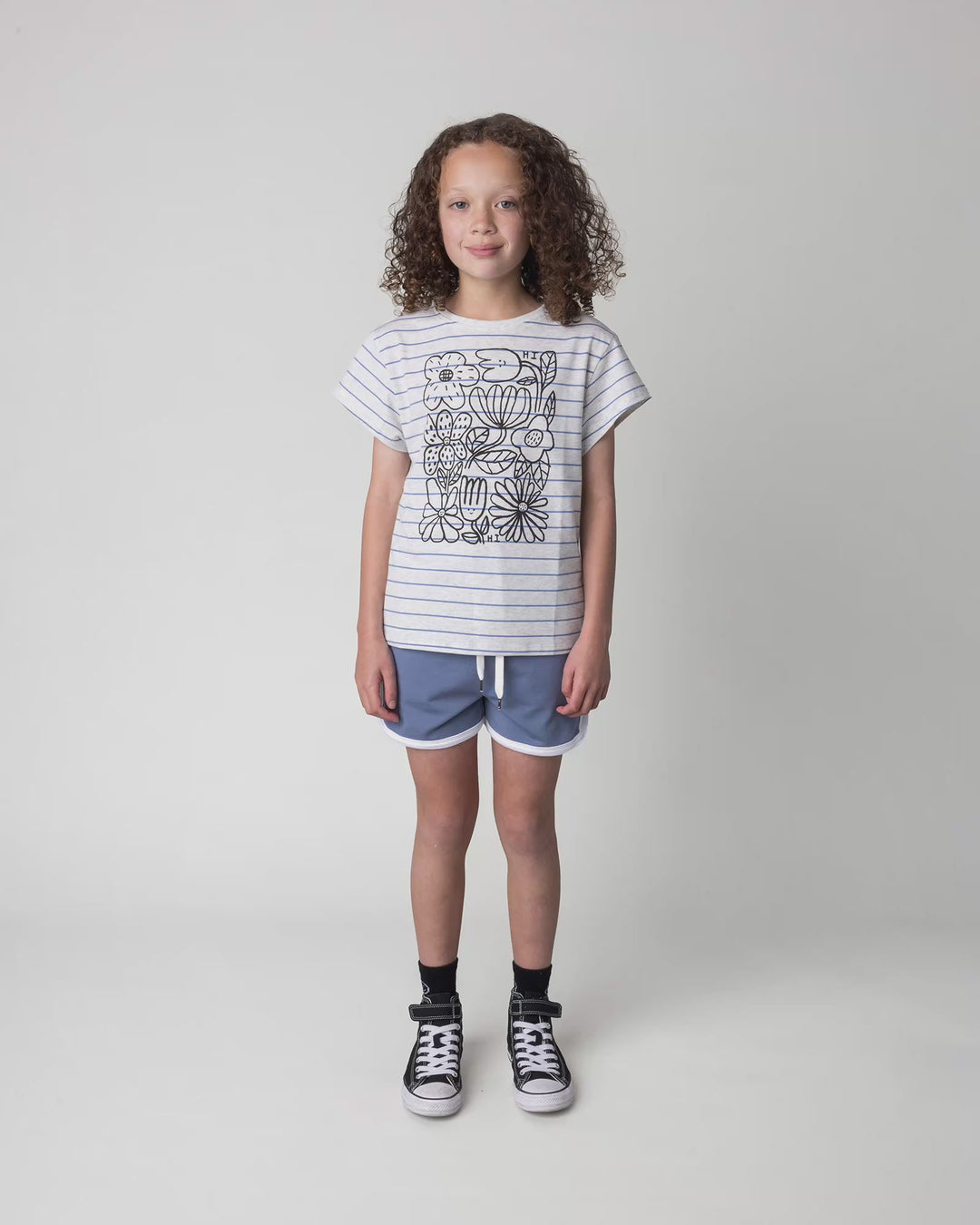 Kid wearing the Flower Party Tee in marle and blue stripe, full circle video