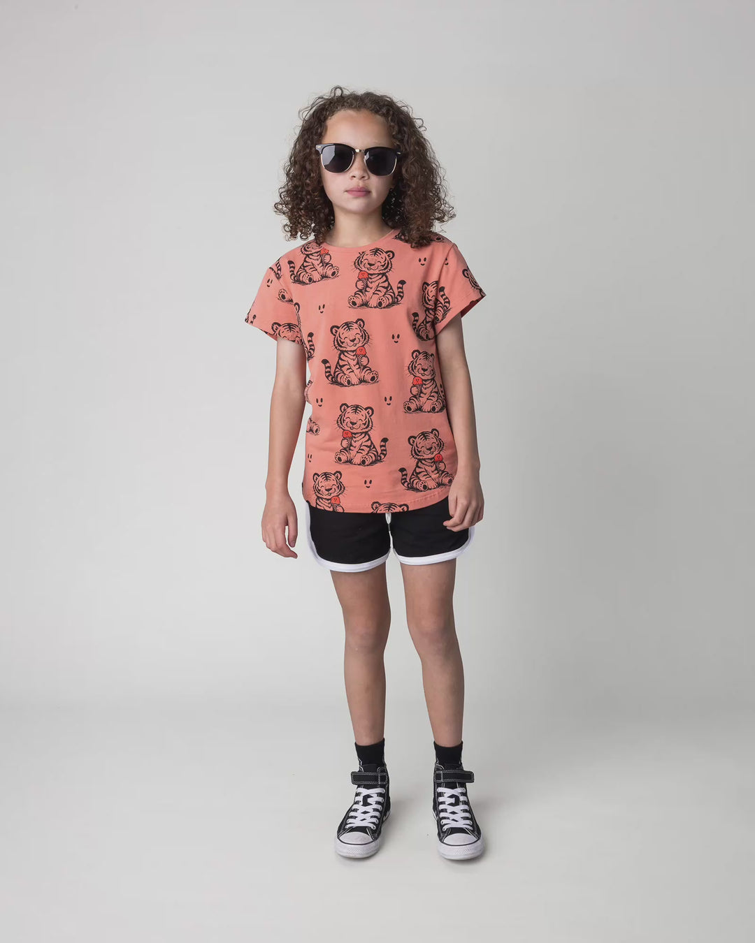 Kid wearing the Happy Tiger Tee in apricot, full circle video