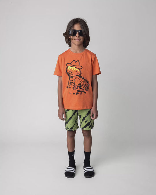 Kid wearing the Howdy Lizard Tee in orange marle, full circle video