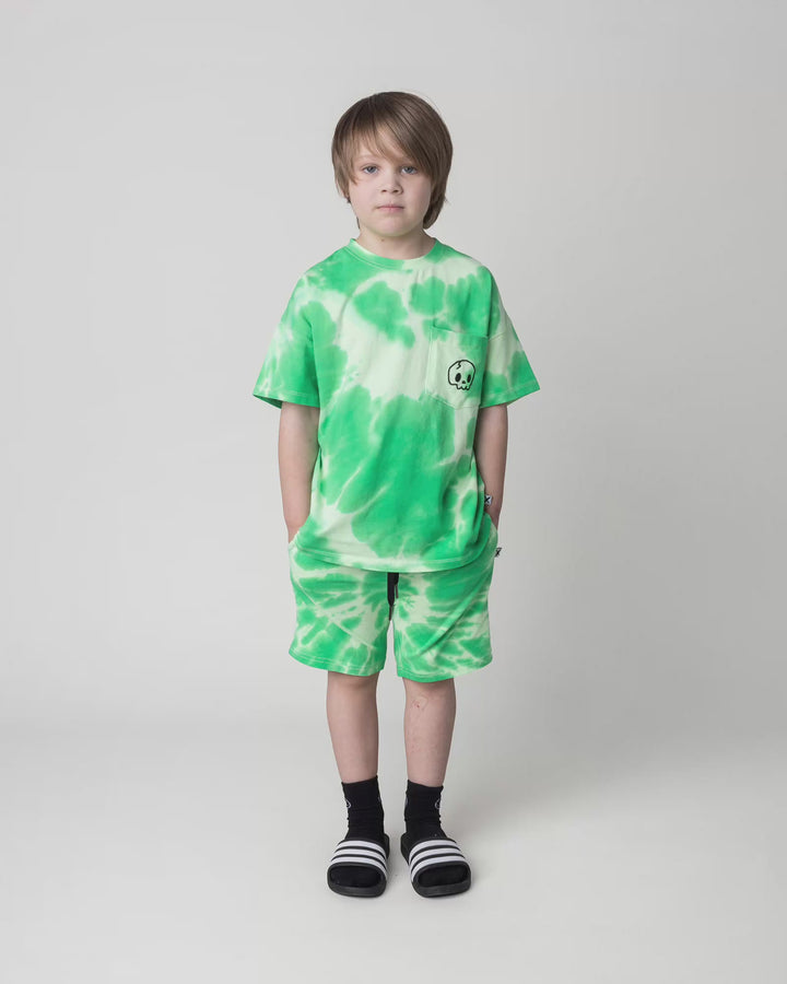 Kid wearing the Splatter Tee in green, full circle video