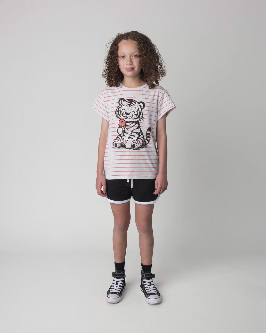 Kid wearing the Happy Tiger Tee in marle and coral stripe, full circle video