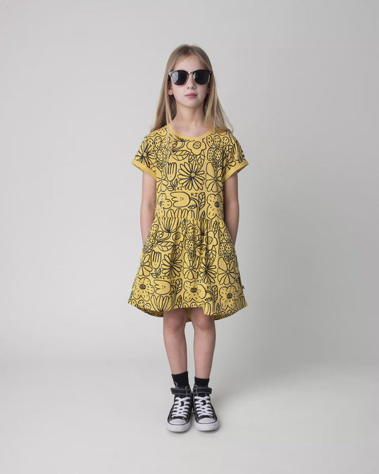 Kid wearing the Big Flowers Dress in mustard stripe, full circle video
