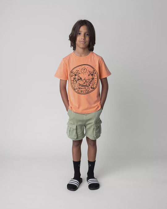 Kid wearing the Chill Sloth Tee in orange wash, full circle video
