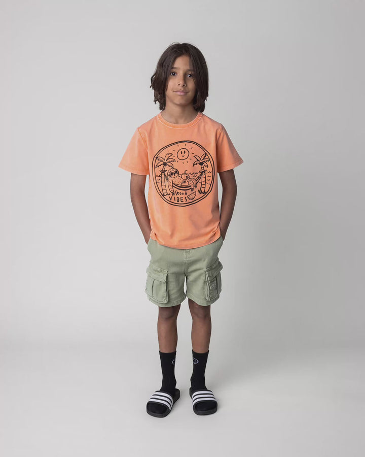 Kid wearing the Chill Sloth Tee in orange wash, full circle video