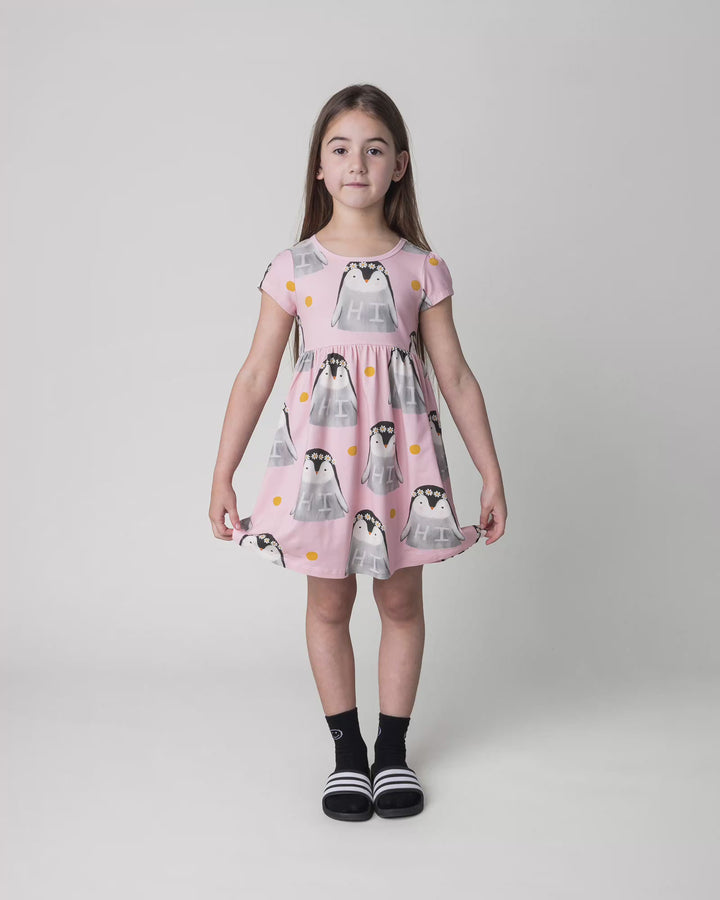 Kid wearing the Flower Penguin Dress in pink, full circle video