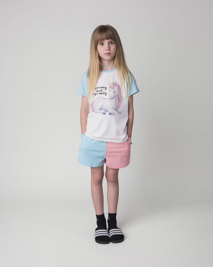 Kid wearing the Daydreaming Unicorn Tee in white and light blue, full circle video