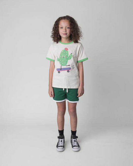 Kid wearing the Skate Cactus Tee in cream and green, full circle video