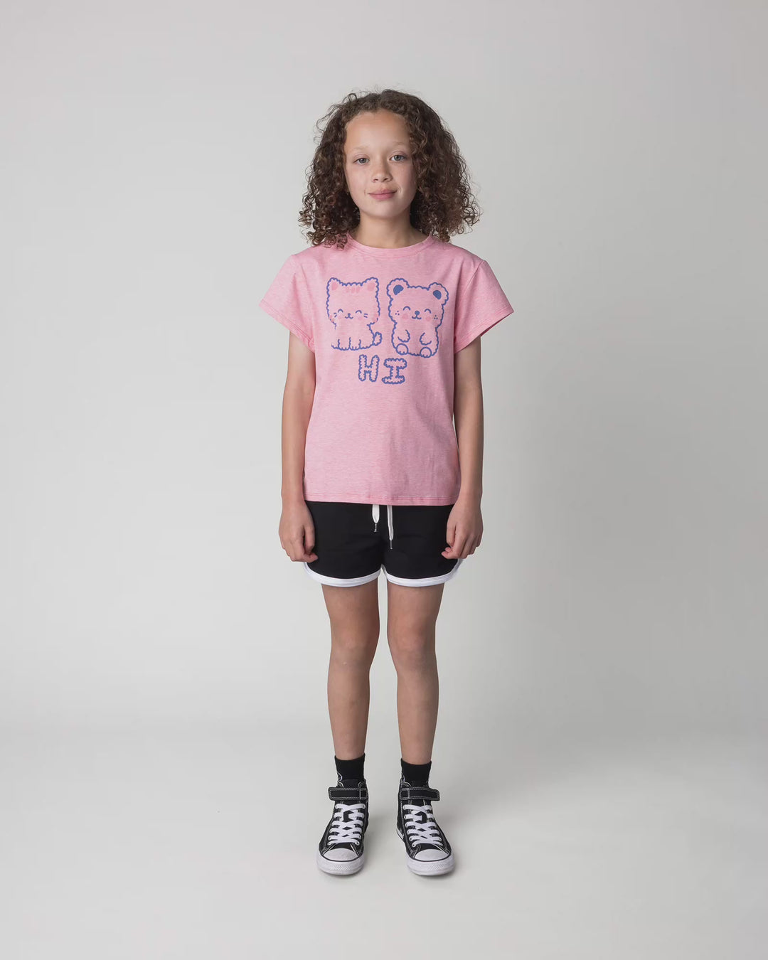 Kid wearing the Hi Cat Bear Tee in strawberry marle, full circle video