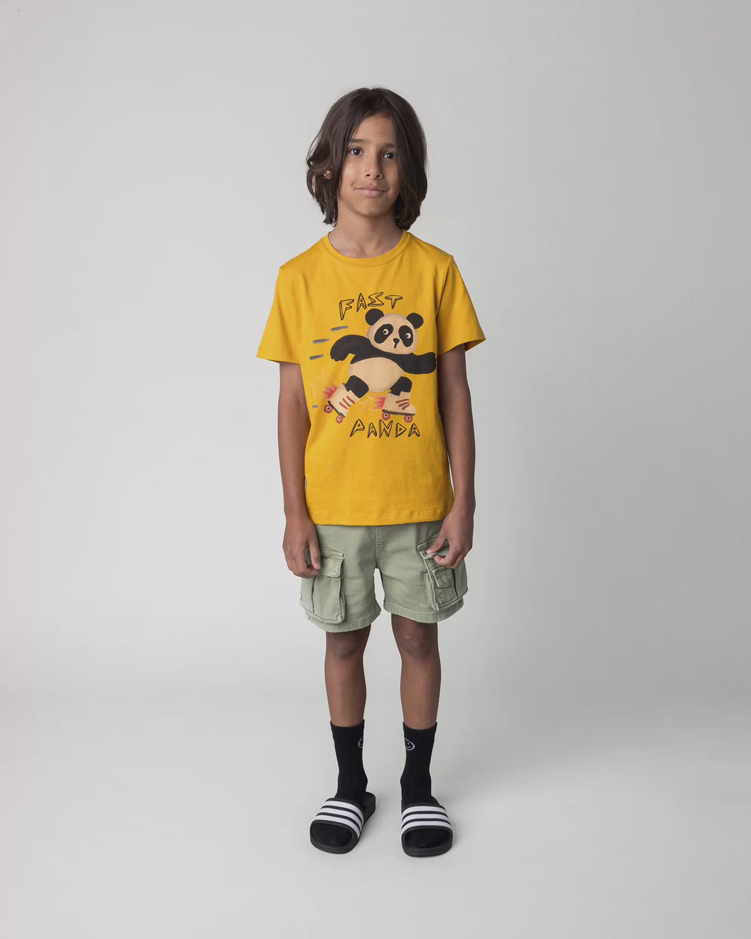 Kid wearing the Fast Panda Tee in mustard, full circle video