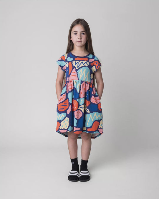Kid wearing the Cool Shapes Dress in dark blue, full circle video