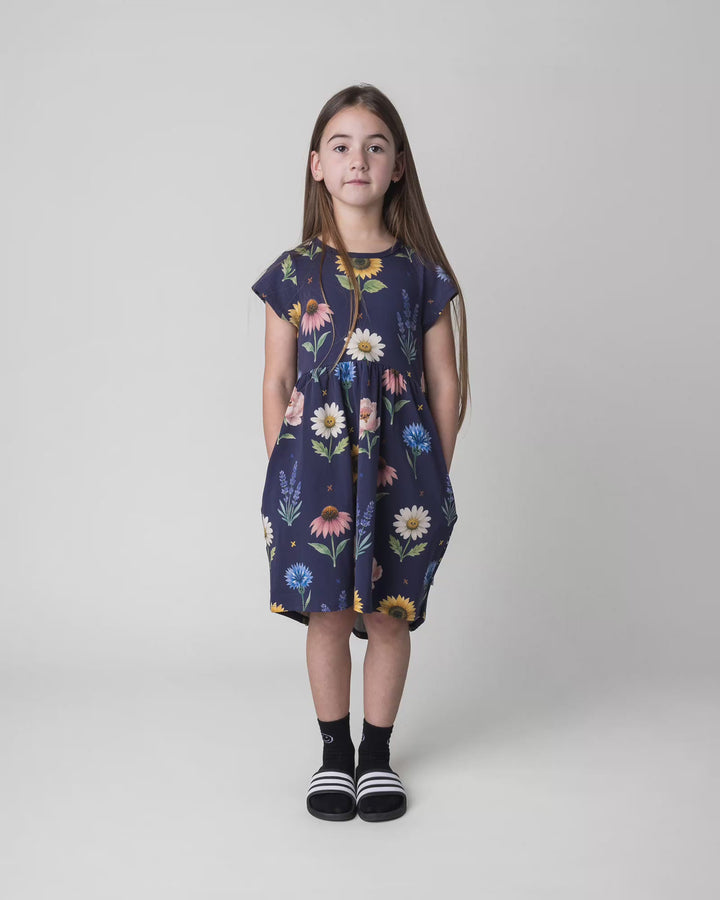Kid wearing the Flower Friends Dress in ink, full circle video