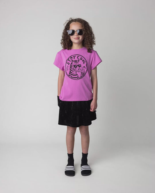 Kid wearing the Stay Cool Tee in violet, full circle video