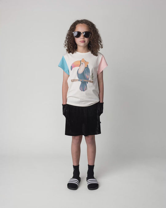 Kid wearing the Hello Toucan Tee in cream, full circle video