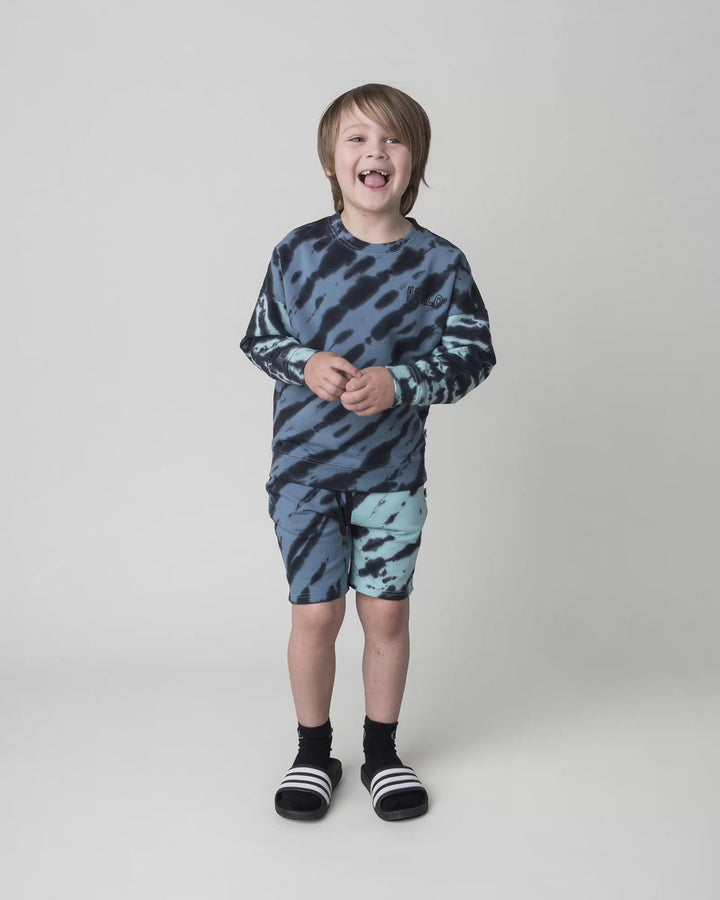 Kid wearing the Duo Tie Dye Short in blue and aqua, full circle video