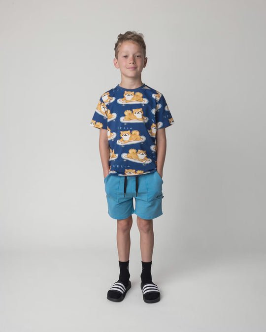 Kid wearing the Blasted Track Short in sky wash, full circle video