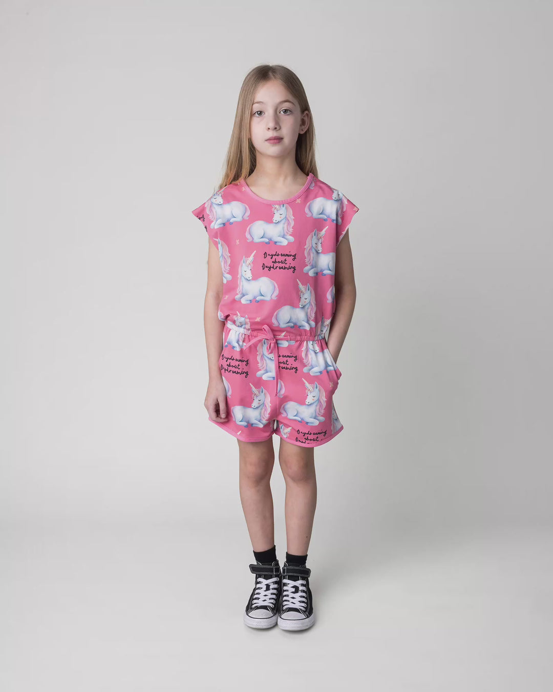 Kid wearing the Daydreaming Unicorn Playsuit in candy, full circle video