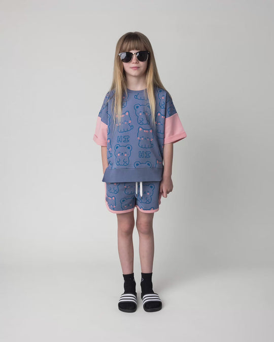Kid wearing the Hi Cat Bear Short in cornflower and pink, full circle video