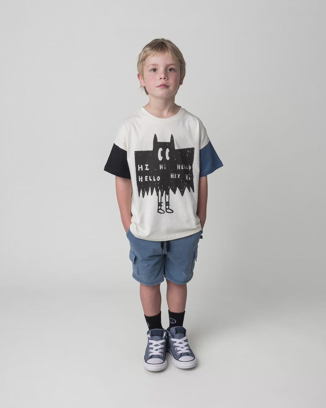 Kid wearing the Greetings Bat Tee in cream, full circle video