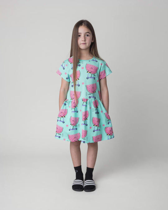 Kid wearing the Scooting Watermelon Dress in light mint, full circle video