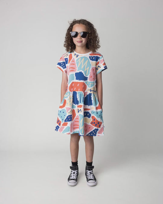 Kid wearing the Cool Shapes Dress in white, full circle video