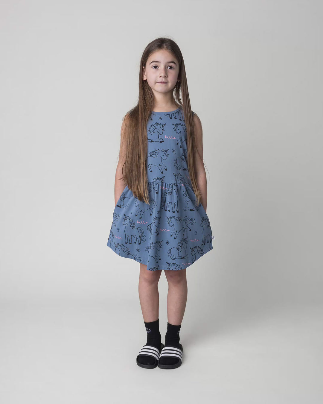 Kid wearing the Hello Unicorns Dress in mid blue, full circle video