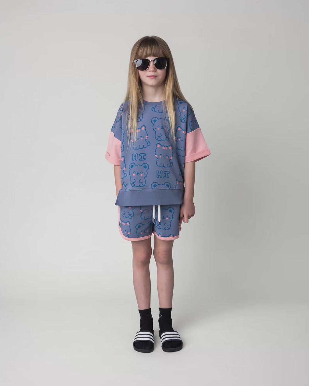 Kid wearing the Hi Cat Bear Short Sleeve Crew in cornflower and pink, full circle video