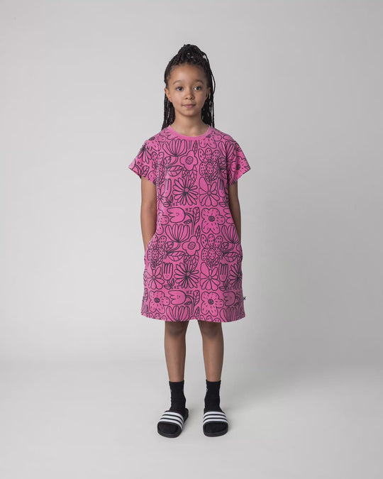Kid wearing the Big Flowers Dress in pink wash, full circle video