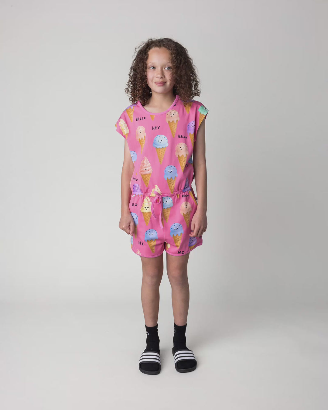 Kid wearing the Happy Icecreams Playsuit in pink, full circle video