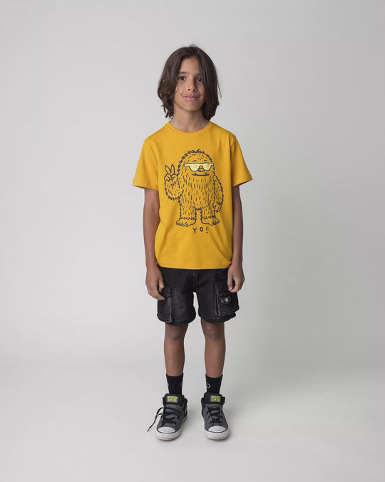 Kid wearing the Yo Yeti Tee in mustard, full circle video