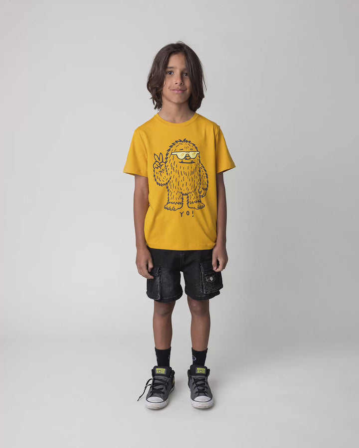 Kid wearing the Yo Yeti Tee in mustard, full circle video