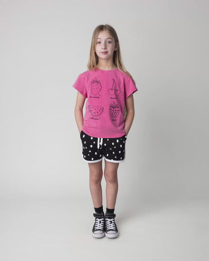 Kid wearing the Different Fruits Tee in pink wash, full circle video
