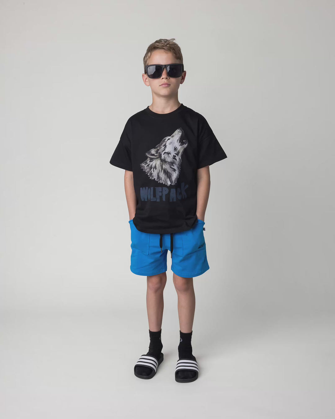 Kid wearing the Track Short in cobalt, full circle video