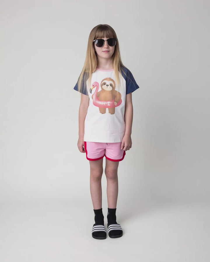 Kid wearing the Swimming Sloth Tee in white, full circle video