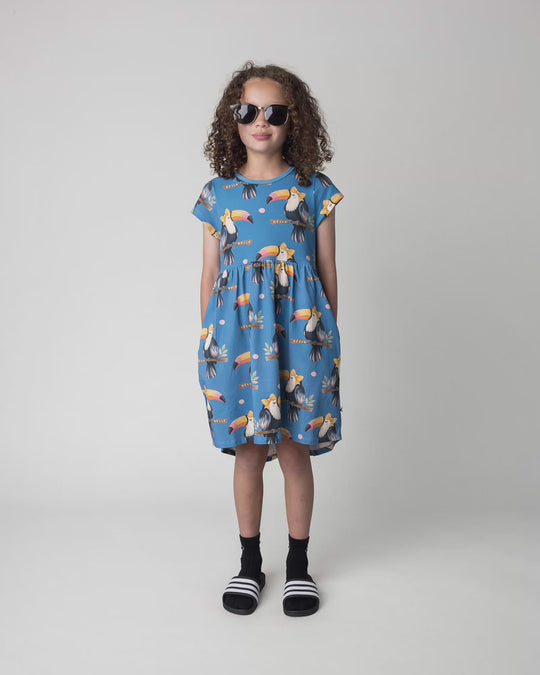 Kid wearing the Hello Toucan Dress in aqua, full circle video