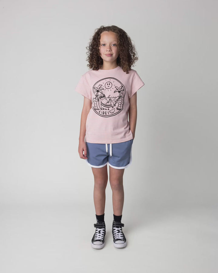 Kid wearing the Chill Sloth Tee in ballet stripe, full circle video