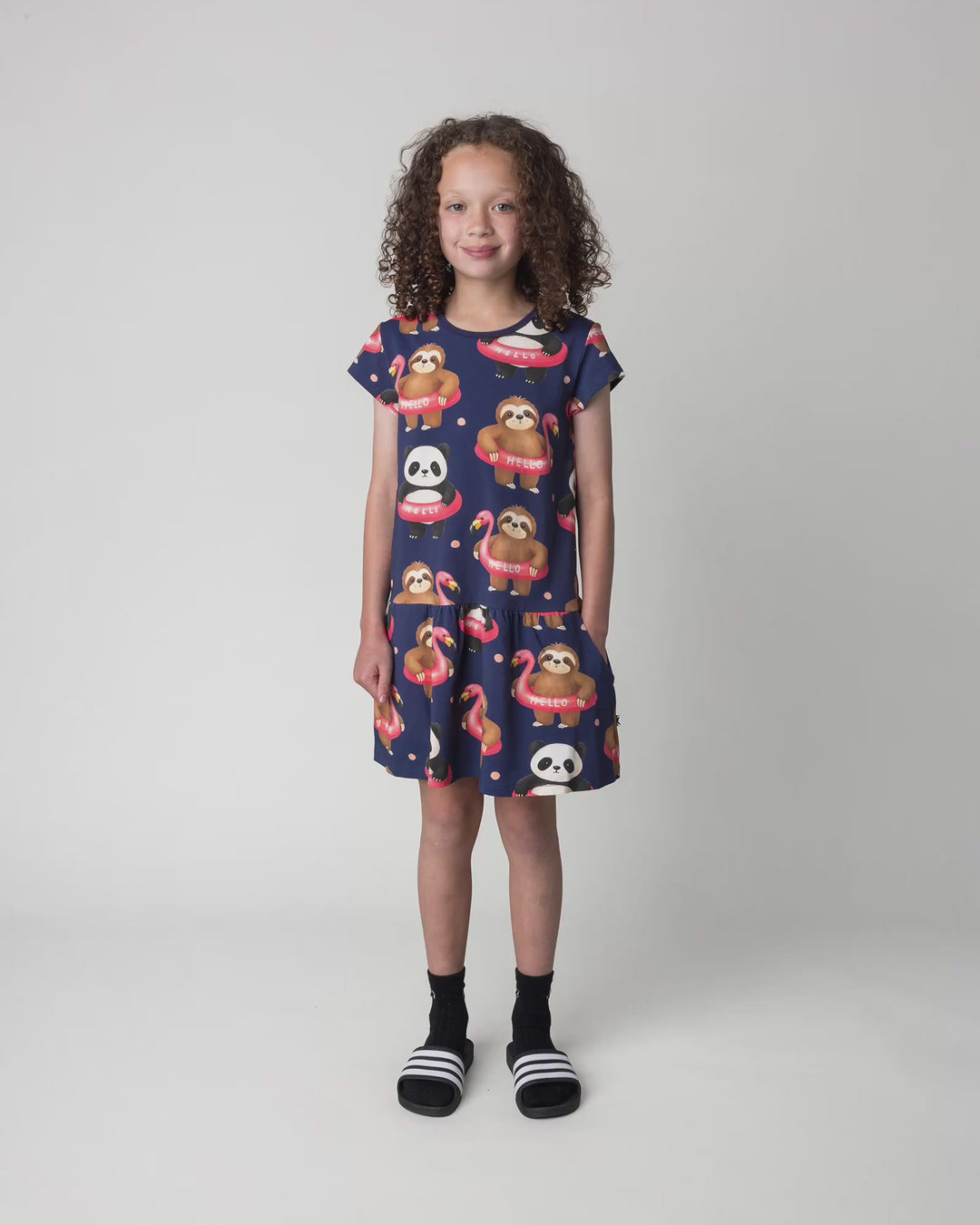 Kid wearing the Swimming Buddies Dress in midnight, full circle video