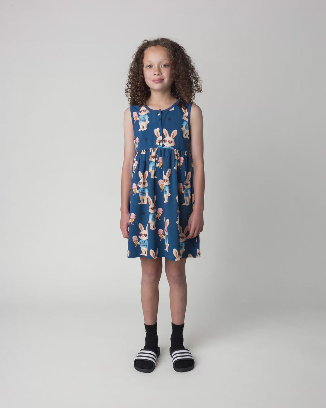Kid wearing the Icecream Bunny Dress in blue, full circle video