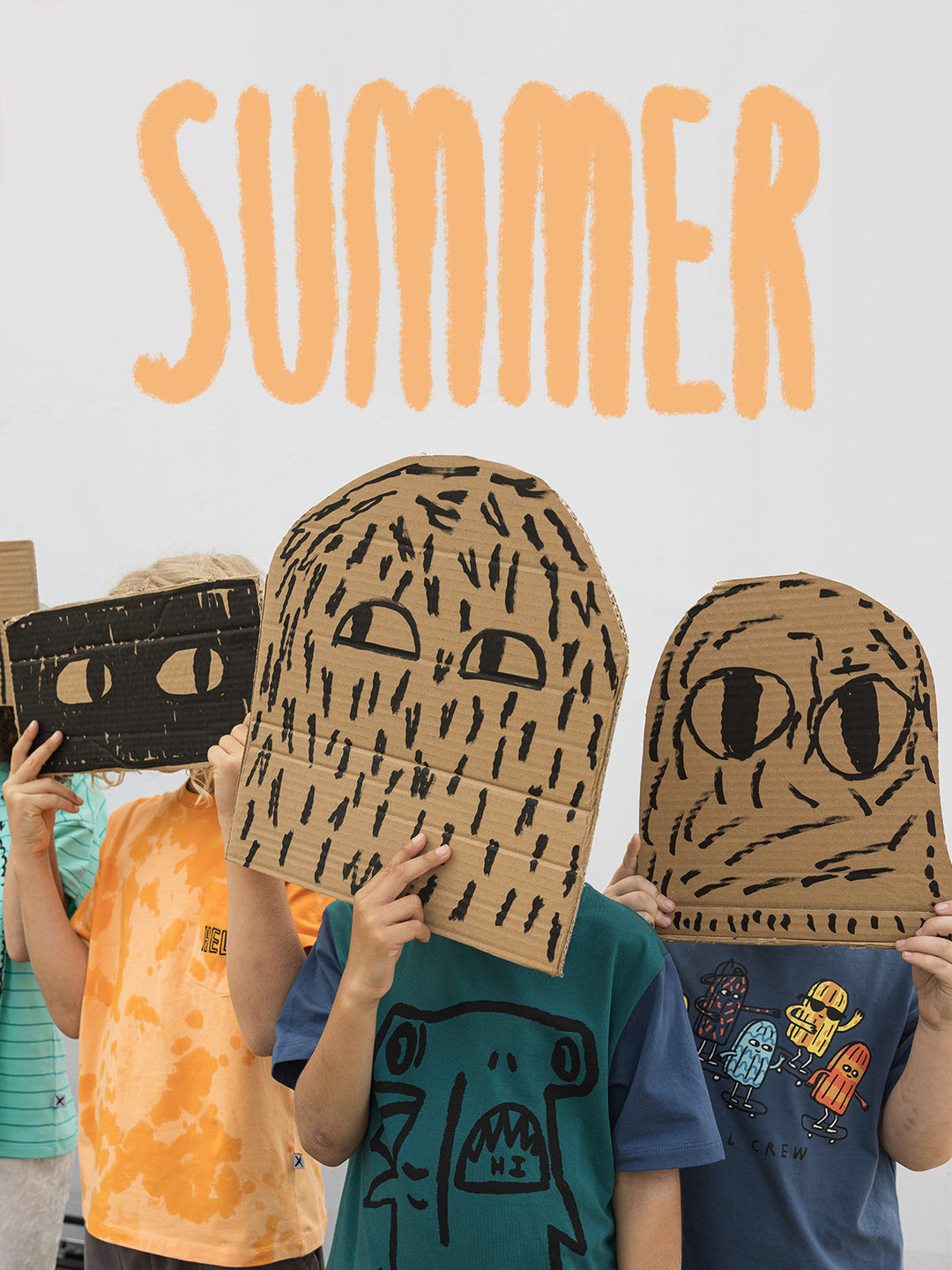 Kids in Minti summer tees holding hand drawn cardboard masks